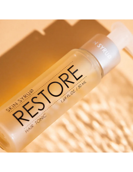 Skin Syrup Restore Hair Tonic on background